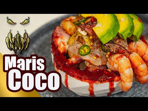 mariscoco-coco-relleno-de-mariscos-bebida-con-curazao-toque-y-sazon